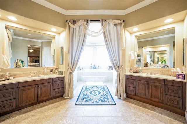 bathroom with vanity, tile patterned floors, ornamental molding, and tiled bath