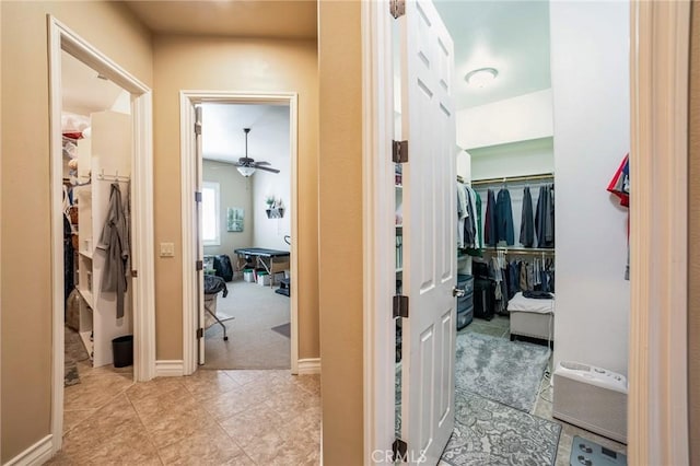 hallway featuring light tile patterned flooring