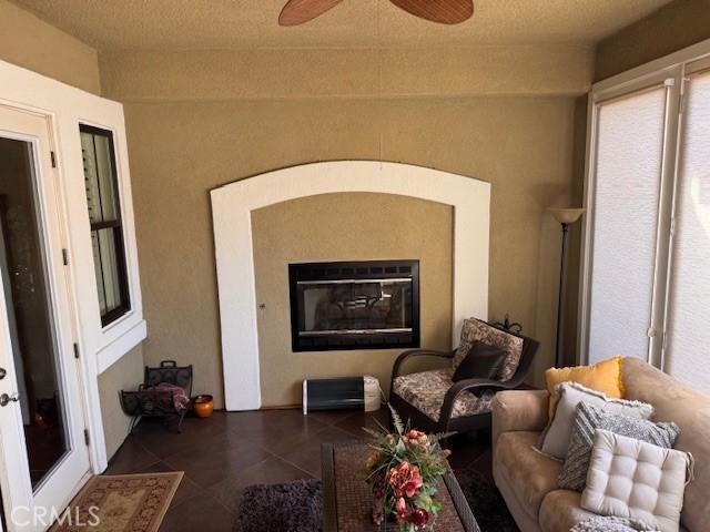 interior space featuring ceiling fan