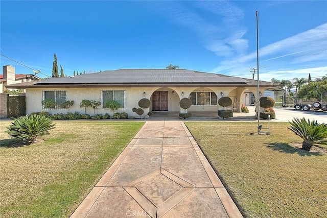 ranch-style home with a front yard