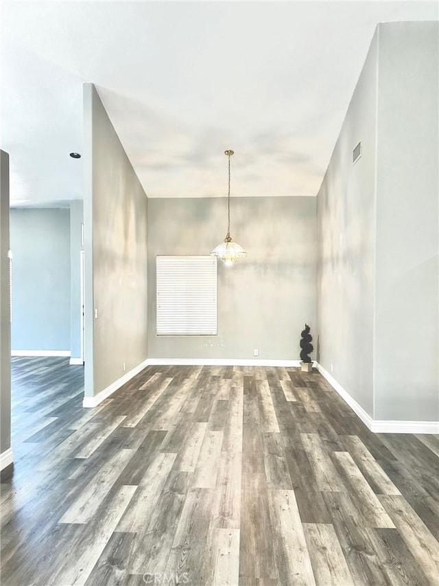 empty room with dark wood-type flooring