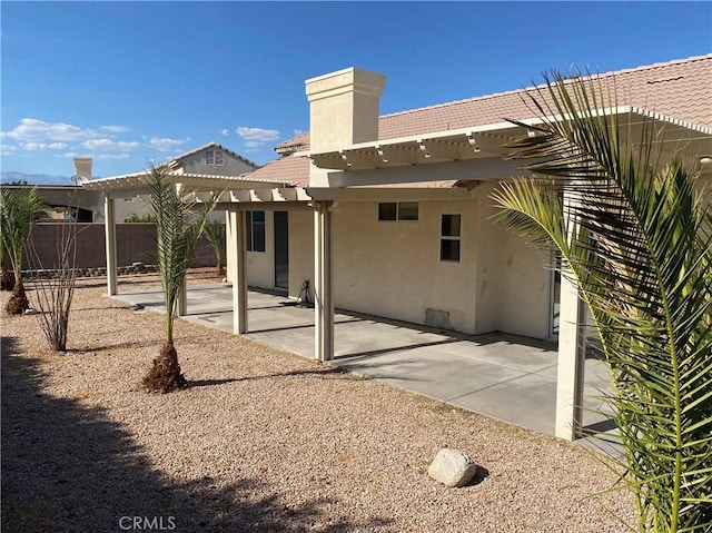 back of property with a patio area