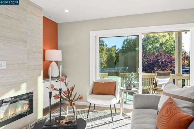 interior space with a tile fireplace