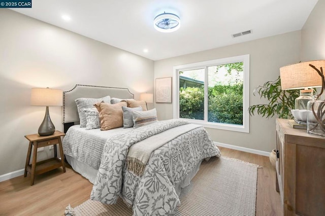 bedroom with light wood-type flooring