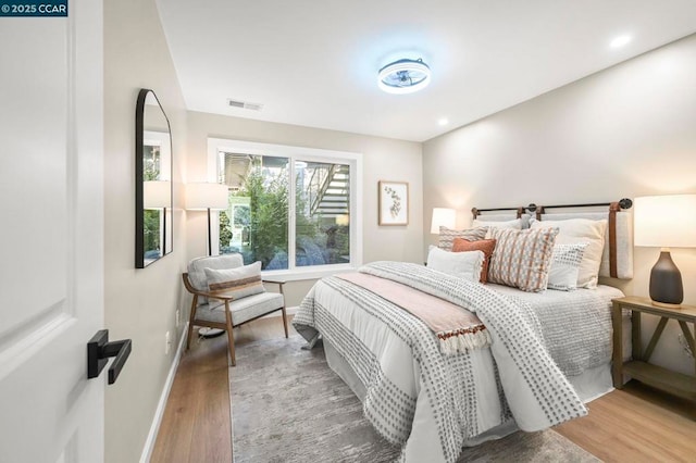 bedroom featuring wood-type flooring