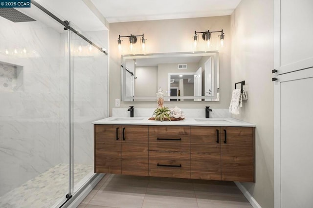 bathroom featuring vanity and a shower with door