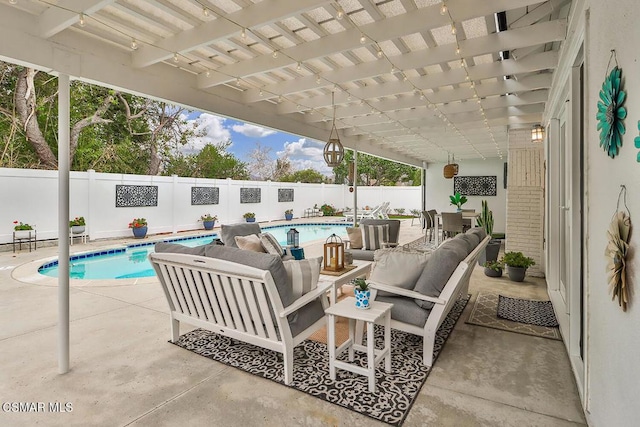 view of patio / terrace featuring a fenced in pool, an outdoor hangout area, and a pergola