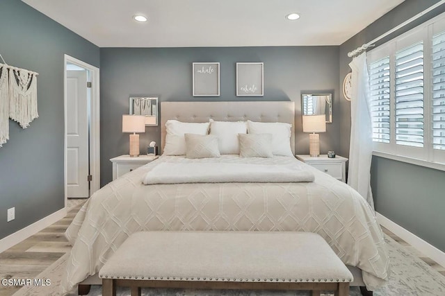 bedroom with light wood-type flooring