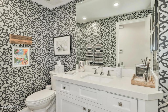 bathroom with vanity and toilet