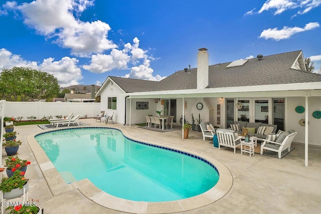 view of pool featuring outdoor lounge area and a patio