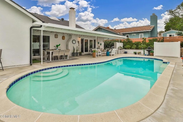 view of swimming pool with a patio