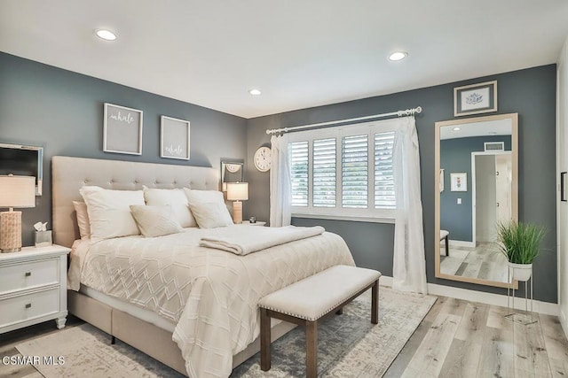 bedroom with light wood-type flooring