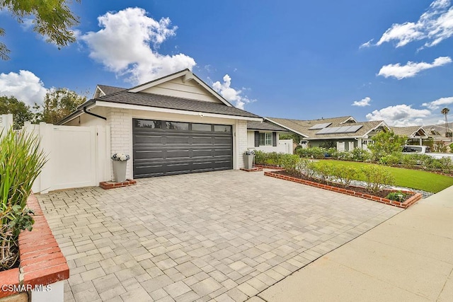 ranch-style house featuring a garage