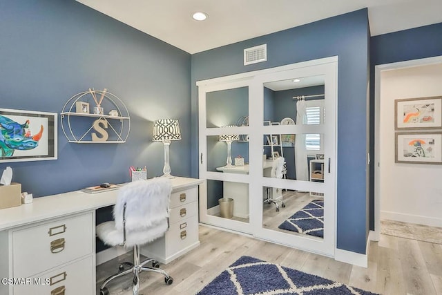 home office featuring light hardwood / wood-style floors