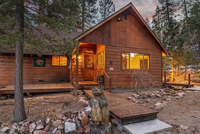 view of front of house with a wooden deck