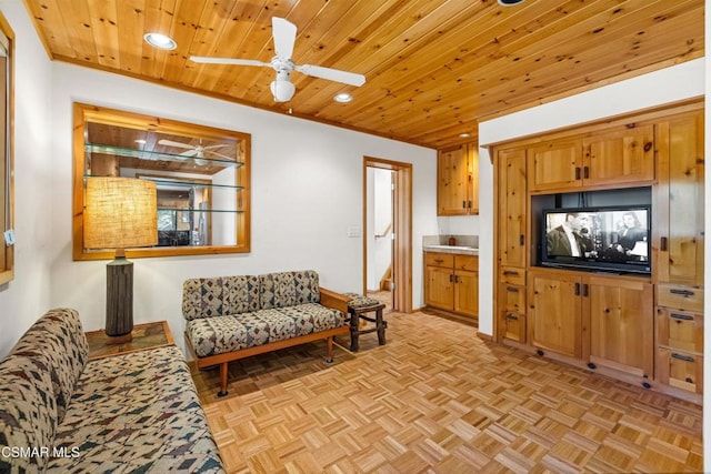 living room featuring ceiling fan, wooden ceiling, and light parquet floors