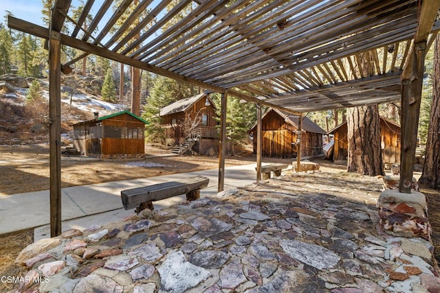 view of patio with a shed