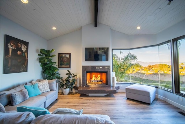 living room featuring vaulted ceiling with beams, wood ceiling, and light hardwood / wood-style flooring