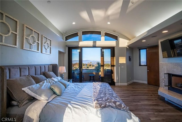 bedroom with lofted ceiling and dark hardwood / wood-style floors