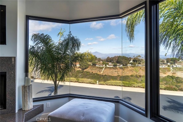 interior space featuring a mountain view and a high end fireplace