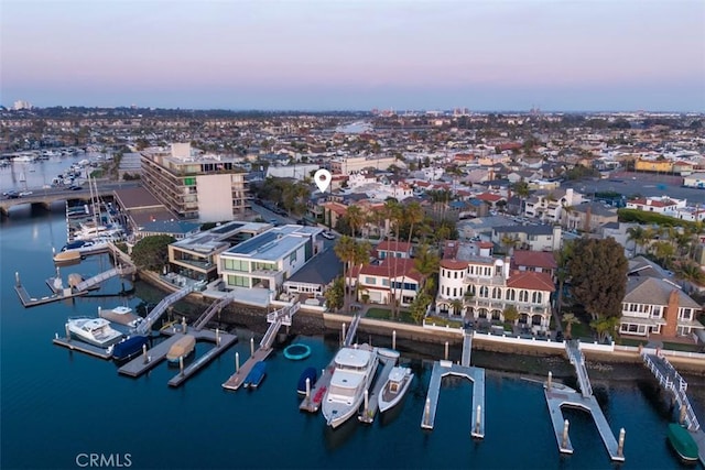 aerial view at dusk with a water view