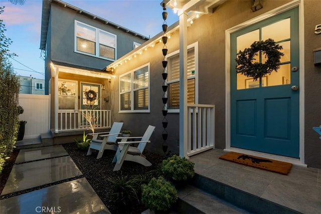 exterior entry at dusk with a porch