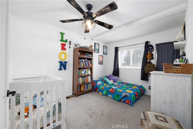 bedroom featuring light colored carpet and ceiling fan