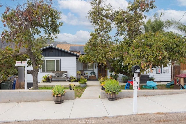 view of front of house featuring solar panels