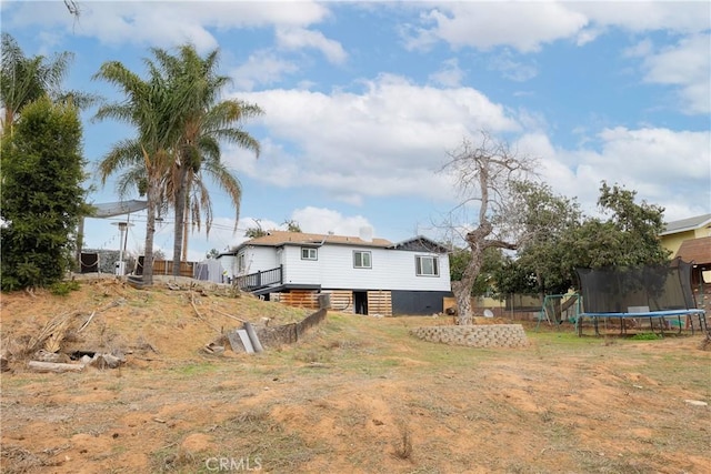 back of property with a trampoline