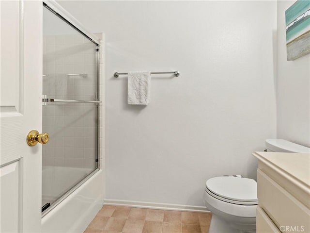 full bathroom featuring vanity, combined bath / shower with glass door, and toilet