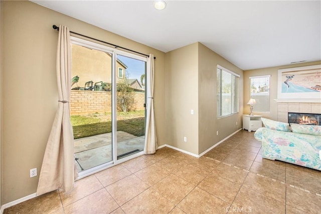 entryway featuring tile patterned floors and a tile fireplace