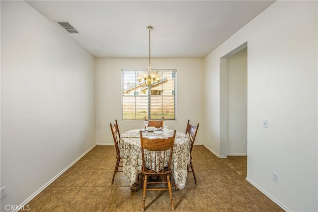 dining area with a notable chandelier