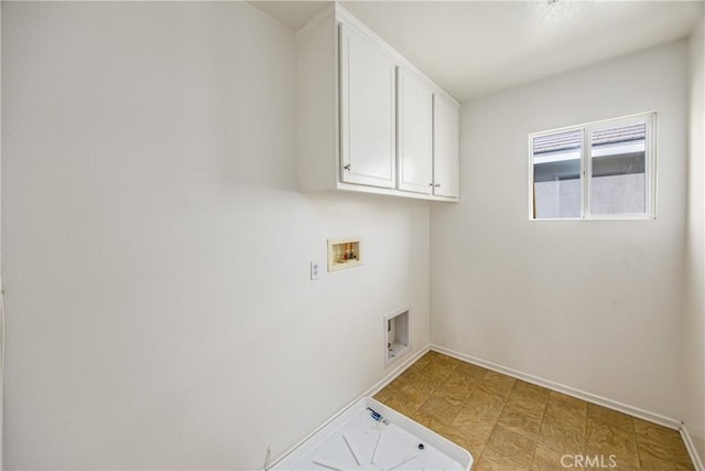 laundry room featuring washer hookup and cabinets