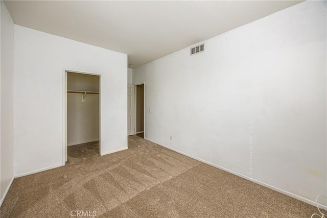 unfurnished bedroom featuring a closet and carpet