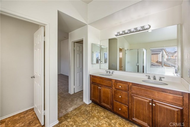 bathroom with a shower with door and vanity