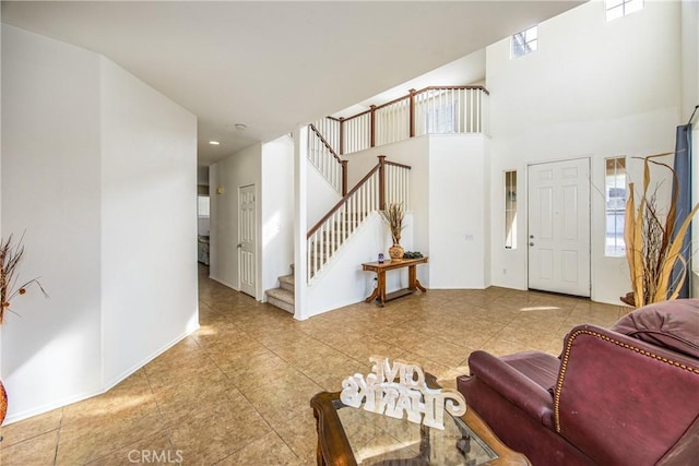 living room with a towering ceiling