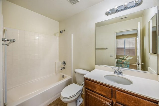 full bathroom featuring vanity, bathtub / shower combination, and toilet