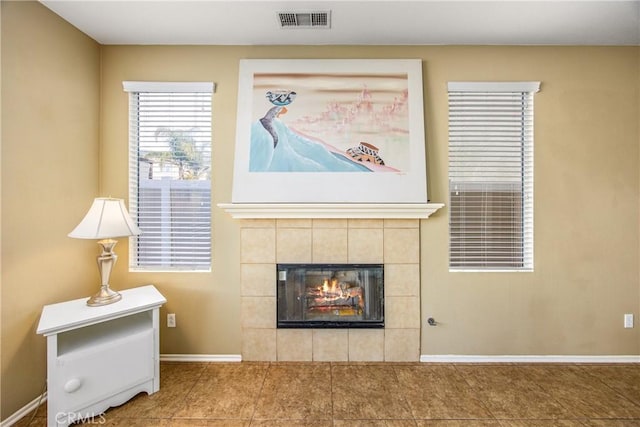 sitting room with a tiled fireplace