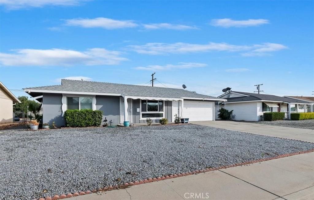 ranch-style home featuring a garage