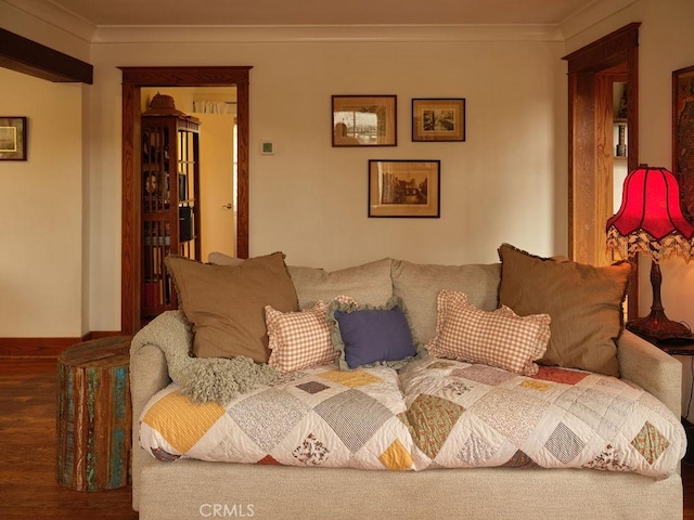 living room featuring crown molding and dark hardwood / wood-style floors