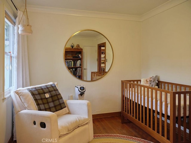 bedroom featuring ornamental molding and wood-type flooring