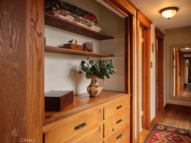 hallway with light hardwood / wood-style floors