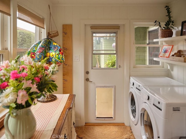 washroom featuring washing machine and dryer