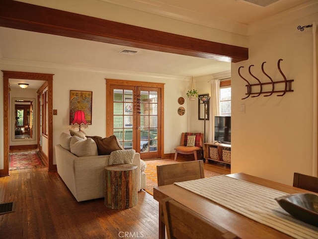 living room with beam ceiling, dark wood-type flooring, and french doors