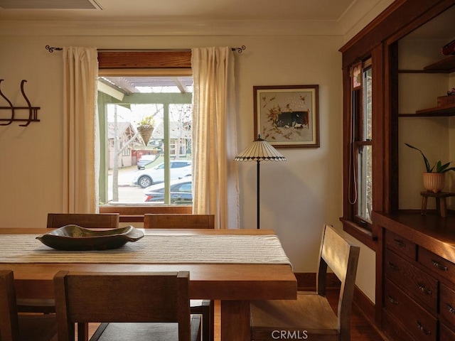 dining area featuring crown molding