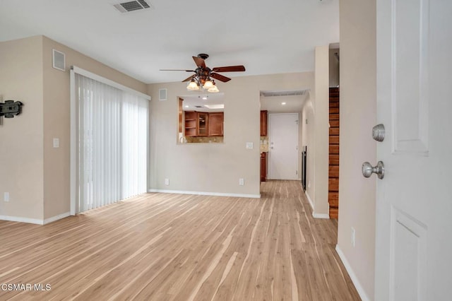 unfurnished living room with light hardwood / wood-style floors and ceiling fan