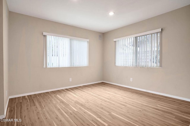 empty room featuring wood-type flooring