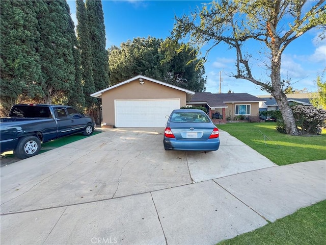 garage featuring a lawn