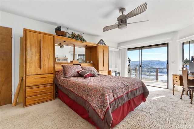 bedroom featuring ceiling fan, light carpet, and access to outside