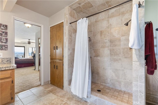 bathroom with vanity, tile patterned flooring, and walk in shower